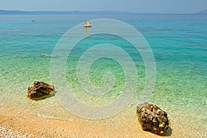 Amazing beach with two big stones and crystal clear water