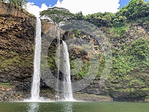 Amazing beautiful big,giant,huge twin Wailua waterfalls on Kauai island, Hawaii. rock face in rainforest with copy space