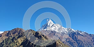 Amazing beautiful scenery view of Machapuchre Himalaya and green hills. It is also known as Fish Tail in Nepal.