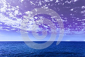 Amazing Beautiful Sunset Sunrise View With Violet Sky. Calm Sea Ocean And Dramatic Sky Background. Very Peri. Bright