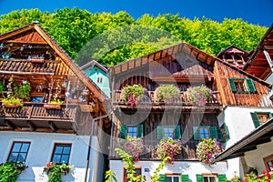 Amazing beautiful town of Hallstatt in sumemr season, Austria. Homes over the lake photo