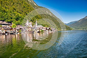 Amazing beautiful town of Hallstatt in sumemr season, Austria. Homes over the lake photo