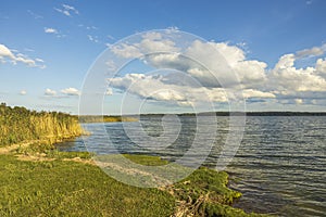 Amazing beauty  sunset on Baltic sea on blue sky with white clouds. Beautiful summer nature backgrounds.