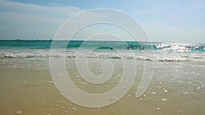 Amazing beauty  white foamy waves and turquoise water on Eagle Beach of Aruba Island. Caribbean.