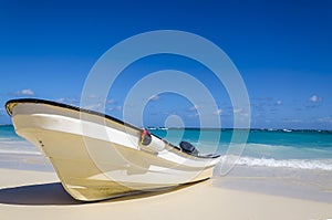 Amazing boat on sandy tropical beach