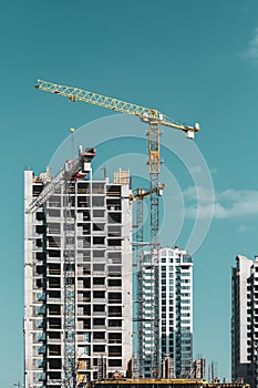 Amazing Bright Blue Clear Sky Above Construction Crane. Construction And Development Of New Multi-storey Residential