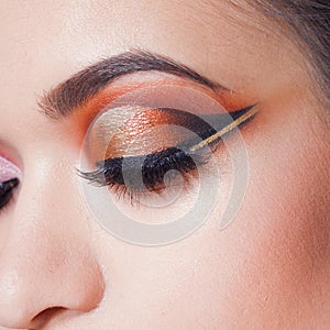 Amazing Bright eye makeup with a wide arrow. Brown and gold tones, colored eyeshadow.