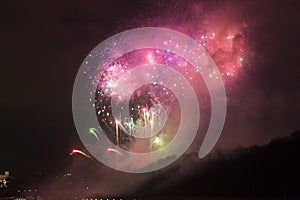 Amazing bright golden and purple firework celebration of the new year 2015 in Prague with the historic city in the background