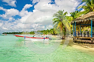 Amazing Caribbean coast with moored motorboat, Dominican Republic photo