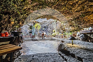 Amazing cave, pool, natural auditorium, salty lake designed by Cesar Manrique in volcanic tunnel called Jameos del Agua in photo