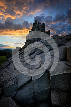 Amazing Chambermaid rock during fiery sunset, Central Bohemian Uplands, Czech republic.