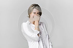 Amazing and cheerful happy blonde in white shirt studio shot, isolated on white