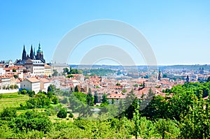 Amazing cityscape of Prague, Czech Republic captured from the Petrin hill with adjacent green park. The dominant of the Czech