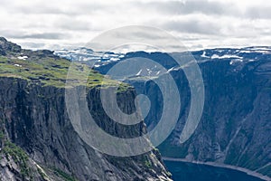 Amazing cliff over the Ringedalsvatnet lake in Trolltunga mounatin area,  Norway