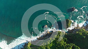 Amazing cliff, rocks and blue ocean in Bali. Aerial view