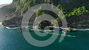 Amazing cliff with rocks and ocean in Bali. Aerial view