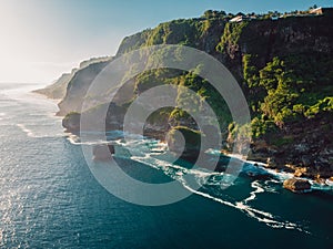 Amazing cliff with rocks and ocean in Bali. Aerial view of ocean