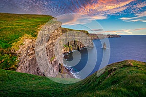 Amazing Cliffs of Moher at sunset in Ireland, County Clare