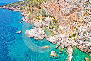 Amazing cliffside beach near Sveta Nedjelja on Hvar island aerial view