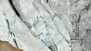 Amazing close up aerial view of floating iceberg of Breidamerkurjokull glacier tongue in Iceland. Drone view of