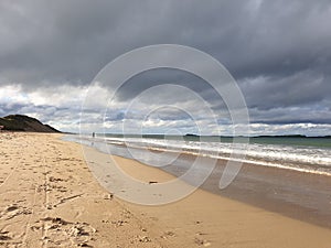 Amazing Cloud Formations in an Autumn Sky at the Beach with Reflections