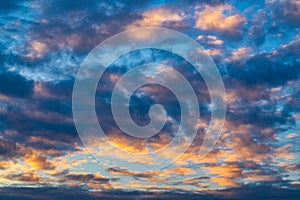 Amazing clouds in blue sky, illuminated by rays of sun at sunset to change weather. Colorful abstract meteorology