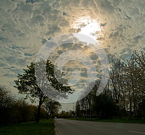 Amazing clouds in a morning road photo