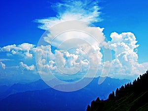 The amazing clouds over the Alps mountain range over the river Rhein valley and Alpstein region