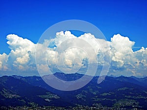 The amazing clouds over the Alps mountain range over the river Rhein valley and Alpstein region