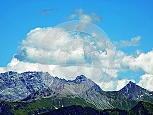 The amazing clouds over the Alps mountain range over the river Rhein valley and Alviergruppe region