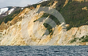 Amazing coast line with orange yellow colored sand limestone rocks and geology structures at shore, perfect expedition on warm