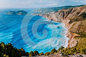 Amazing coastline landscape near Assos village. Sea waves rolling to shore cliffs on the beach. Kefalonia, Ionian