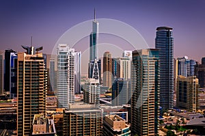 Amazing colorful dubai marina skyline with water canal and expensive yachts, Dubai, United Arab Emirates.