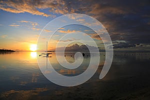 Amazing colorful sunset on the beach of Moorea