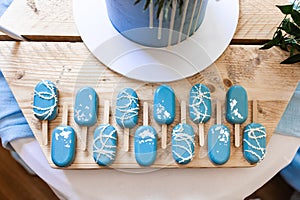 Amazing colours blue and white chocolate decorated with icing lolly