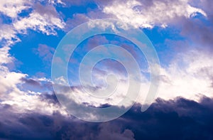 Amazing contrast white and dark clouds and clear blue sky