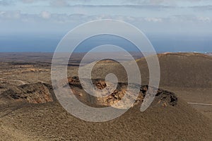 Amazing crater in a volcanic landscape of Timanfaya national park, Lanzarote, Canary Islands