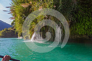 Amazing crystalline blue water of Tamul waterfall, Close up view of spectacular Tamul River,at Huasteca Potosina in San Luis