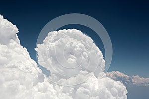 Amazing cumulus cloud formation in dark blue sky