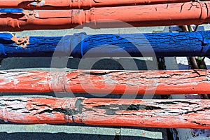 Amazing detailed closeup view of old cracked rubber covered communication pipes, abstract