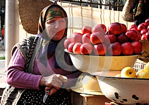 Amazing Display of Apples and an Old Woman
