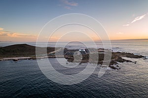 Amazing drone aerial landscape view of a Sea fishing farm on land at sunset in Galiza, Spain photo
