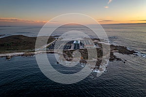 Amazing drone aerial landscape view of a Sea fishing farm on land at sunset in Galiza, Spain photo