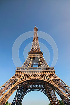 The amazing Eiffel Tower in Paris. Tower is one of the most recognizable landmarks in the world. Famous touristic pl photo