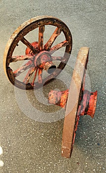 Amazing engineering: 19th century wheels perfectly balanced stand upright although the wheel hubs have different geometries photo