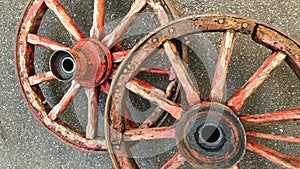 Amazing engineering: 19th century wheels perfectly balanced stand upright although the wheel hubs have different geometries photo