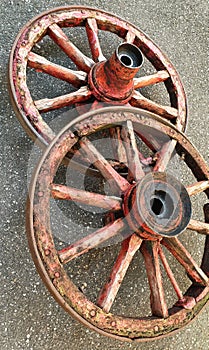 Amazing engineering: 19th century wheels perfectly balanced stand upright although the wheel hubs have different geometries photo