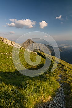 Amazing evening on ridge of the summer mountains