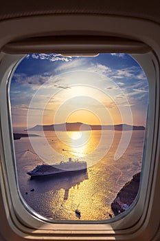 Amazing evening view of Fira, caldera, volcano of Santorini, Greece with cruise ships at sunset.