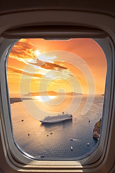 Amazing evening view of Fira, caldera, volcano of Santorini, Greece with cruise ships at sunset.